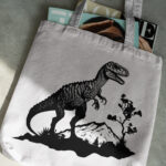 296_Ceratosaurus_on_a_canyon_5368-transparent-tote_bag_1.jpg