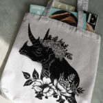 314_Triceratops_with_a_crown_of_flowers_9454-transparent-tote_bag_1.jpg