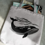 378_Whale_swimming_in_the_ocean_8632-transparent-tote_bag_1.jpg