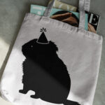 569_Guinea_pig_in_a_party_hat_1777-transparent-tote_bag_1.jpg
