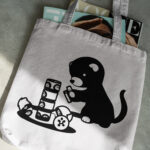 627_Ferret_playing_with_a_toy_8701-transparent-tote_bag_1.jpg