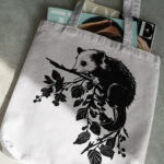 696_opossum_hanging_from_a_branch_2858-transparent-tote_bag_1.jpg