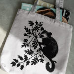 698_opossum_hanging_from_a_branch_5697-transparent-tote_bag_1.jpg