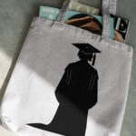894_cap_gown_and_diploma_graduation_1160-transparent-tote_bag_1.jpg